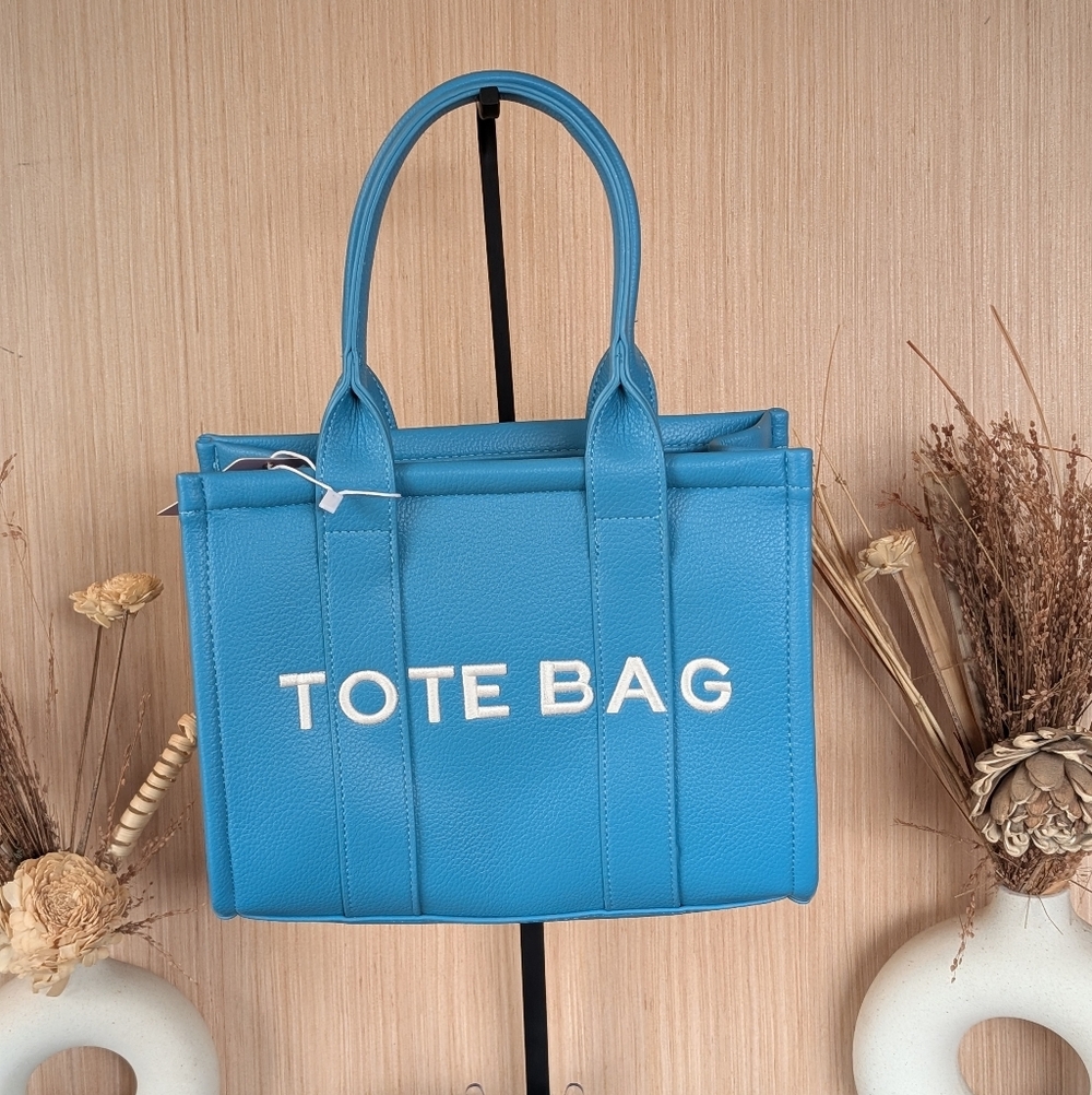 Sky Blue Tote Bag With Crossbody Strap Included.